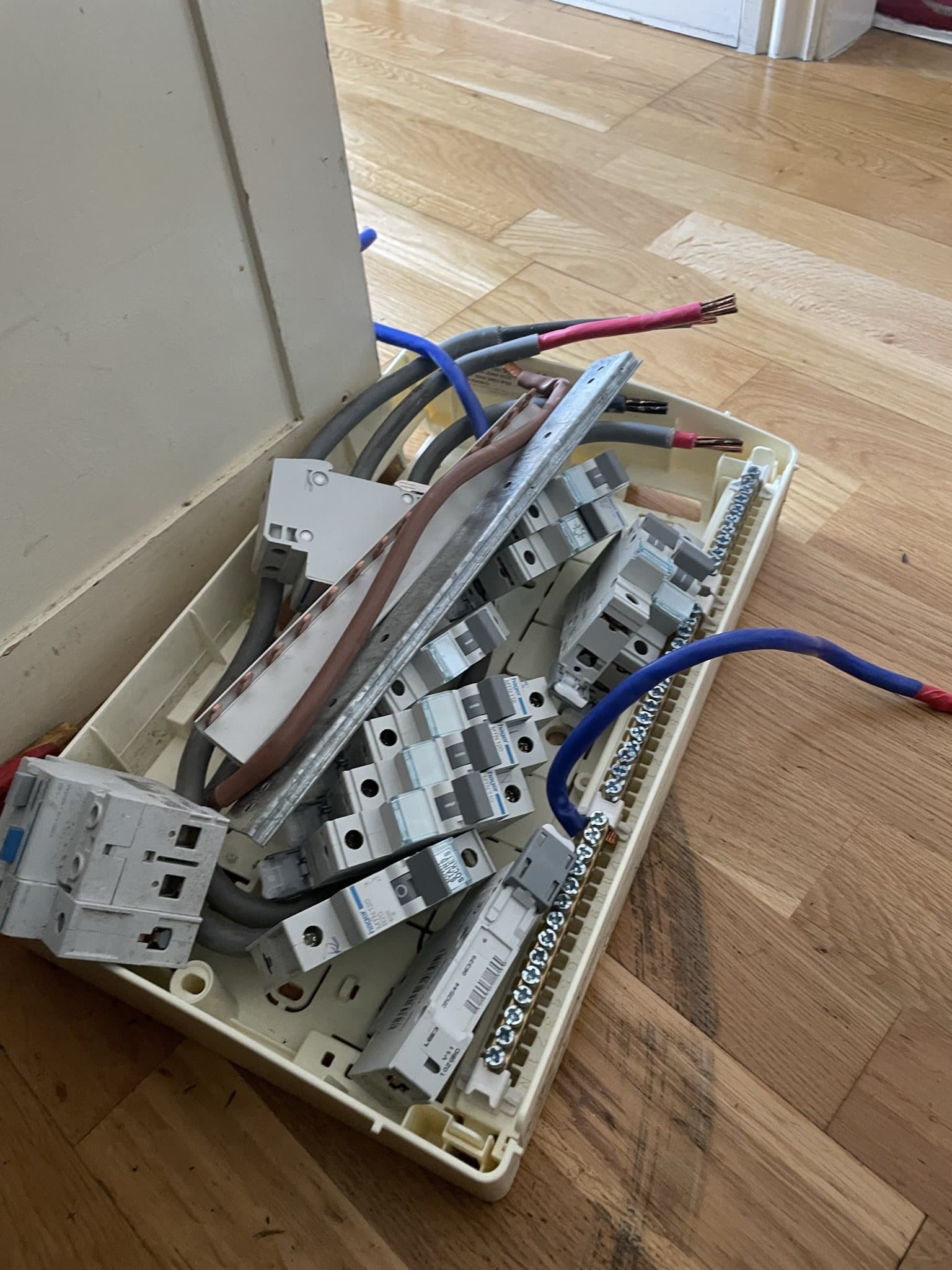 New metal consumer unit enclosure being installed